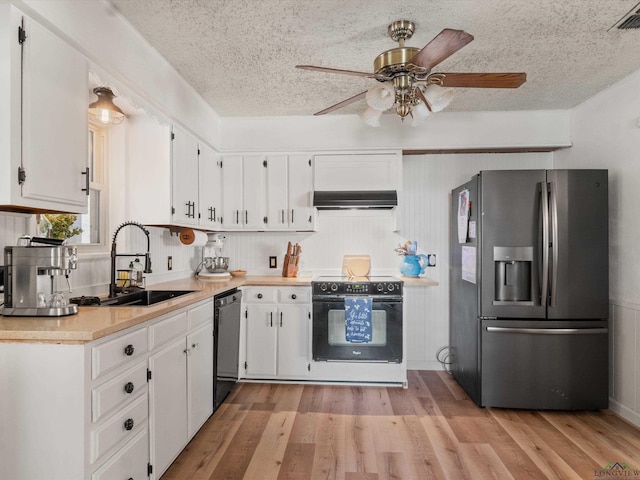 kitchen featuring white cabinetry, sink, and black appliances