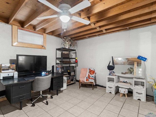 office space featuring beamed ceiling, light tile patterned floors, and ceiling fan