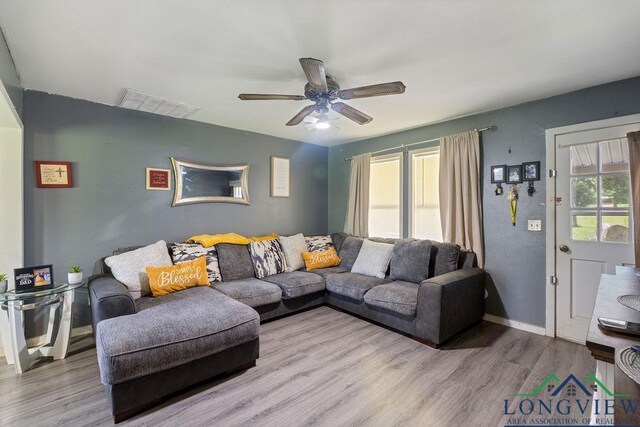 9819 US Highway 84e, Joaquin, TX 75954 - living area featuring ceiling fan, wood finished floors, and baseboards