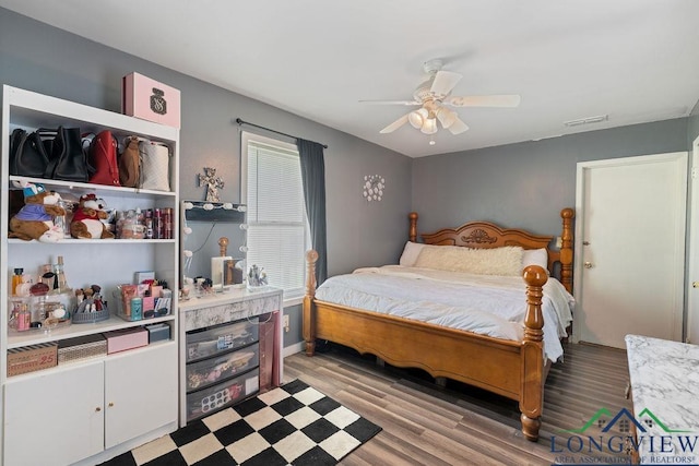 9819 US Highway 84e, Joaquin, TX 75954 - bedroom featuring light wood-style floors, ceiling fan, and baseboards