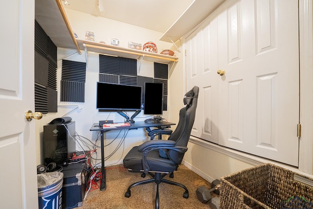 carpeted home office with baseboards