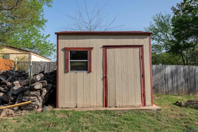 view of shed with a fenced backyard