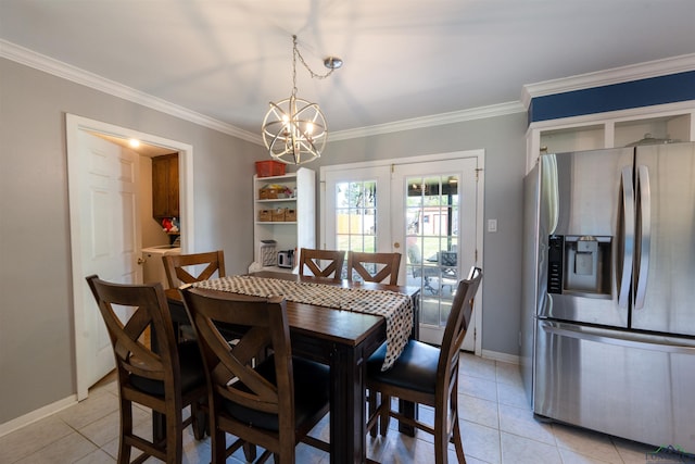 dining space with ornamental molding, a chandelier, french doors, and light tile patterned floors