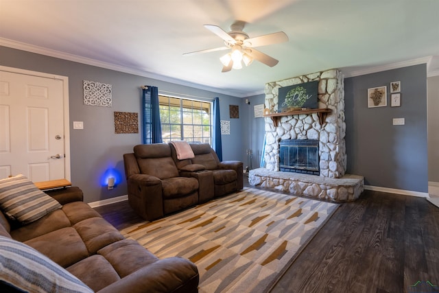 living room with baseboards, crown molding, wood finished floors, and a ceiling fan