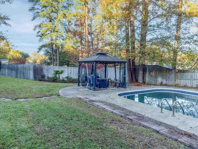 view of pool featuring a gazebo and a lawn