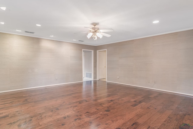 unfurnished room with ceiling fan, dark hardwood / wood-style flooring, and ornamental molding