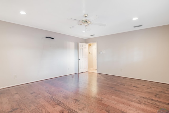 empty room with ceiling fan and light wood-type flooring