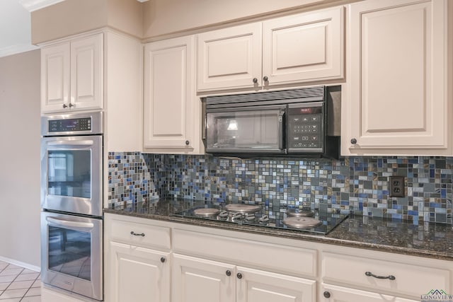 kitchen featuring backsplash, white cabinets, and black appliances