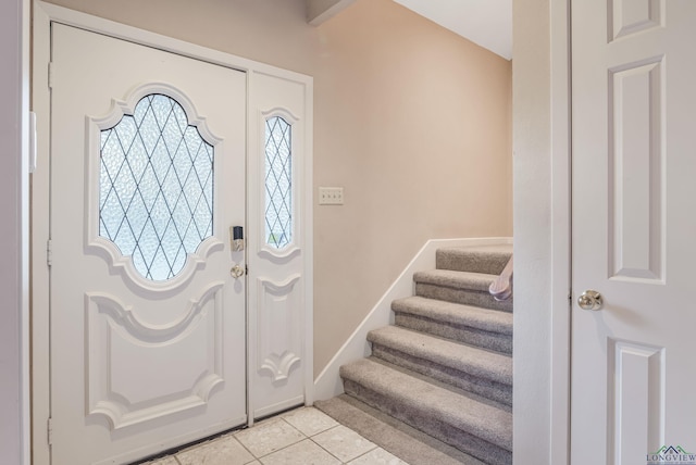 entrance foyer featuring light tile patterned floors