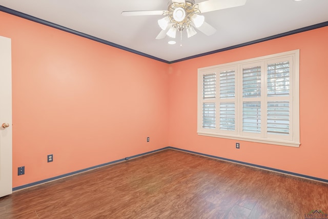 empty room with ceiling fan, wood-type flooring, and crown molding