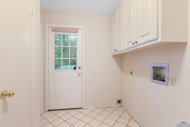 laundry area with hookup for an electric dryer, cabinets, light tile patterned floors, and hookup for a washing machine