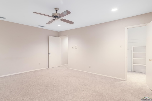 carpeted empty room with ceiling fan