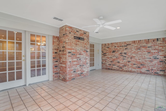 view of patio / terrace featuring ceiling fan and french doors