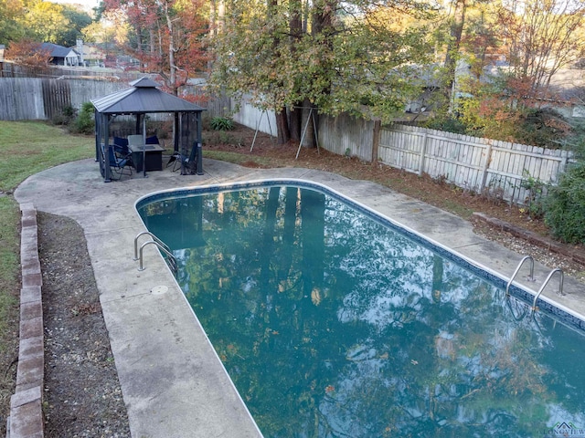 view of swimming pool with a gazebo