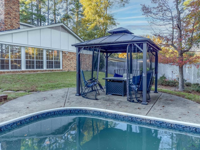 view of swimming pool with a gazebo, a patio area, and a lawn