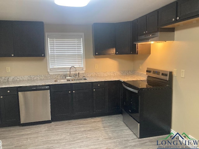 kitchen featuring sink, stainless steel appliances, and light wood-type flooring