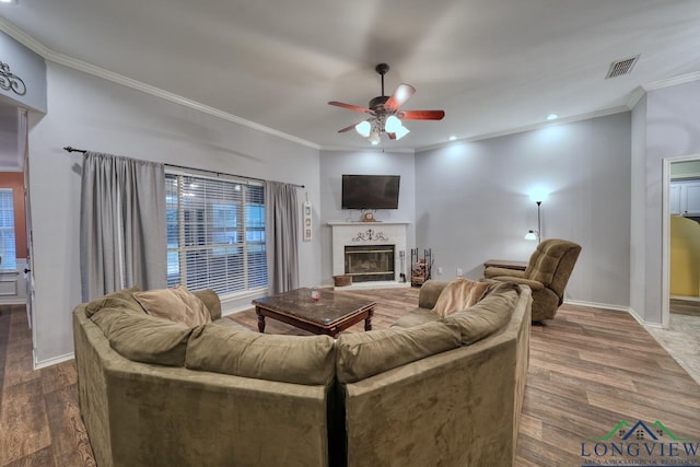 846 Edgewood Cir, Lindale, TX 75771 - living room with crown molding, a ceiling fan, wood finished floors, baseboards, and a glass covered fireplace