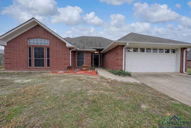 846 Edgewood Cir, Lindale, TX 75771 - single story home with brick siding, a garage, concrete driveway, a front lawn, and roof with shingles