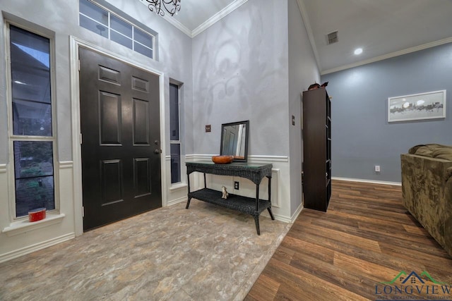 846 Edgewood Cir, Lindale, TX 75771 - entryway featuring ornamental molding, wood finished floors, a chandelier, and a towering ceiling