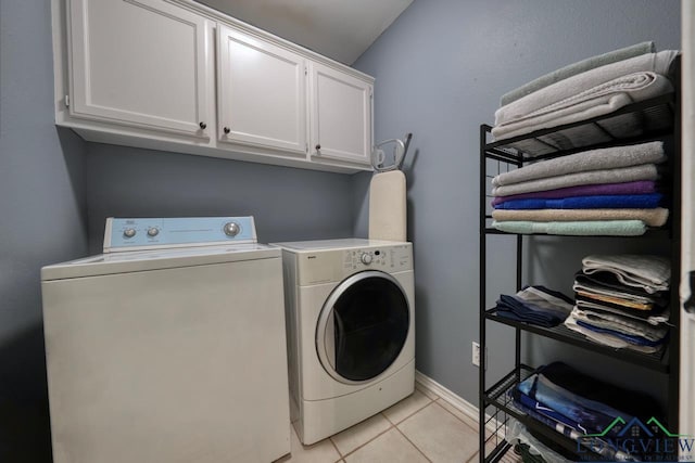 846 Edgewood Cir, Lindale, TX 75771 - laundry area featuring washer and clothes dryer, cabinet space, light tile patterned floors, and baseboards