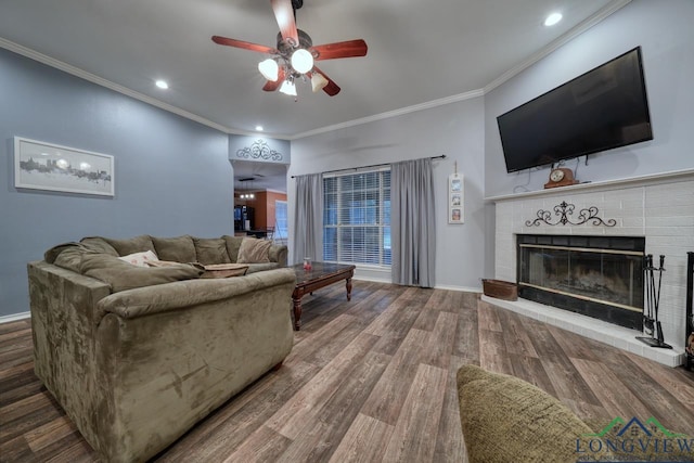 846 Edgewood Cir, Lindale, TX 75771 - living room featuring a ceiling fan, a fireplace, baseboards, wood finished floors, and crown molding