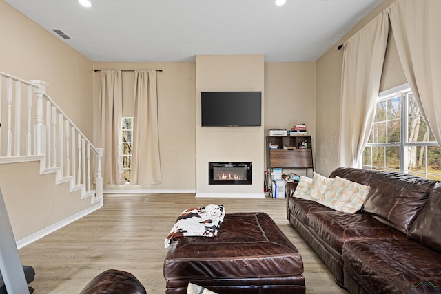 living room with light hardwood / wood-style flooring