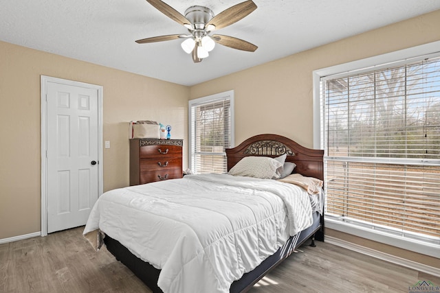 bedroom featuring ceiling fan and light wood-type flooring