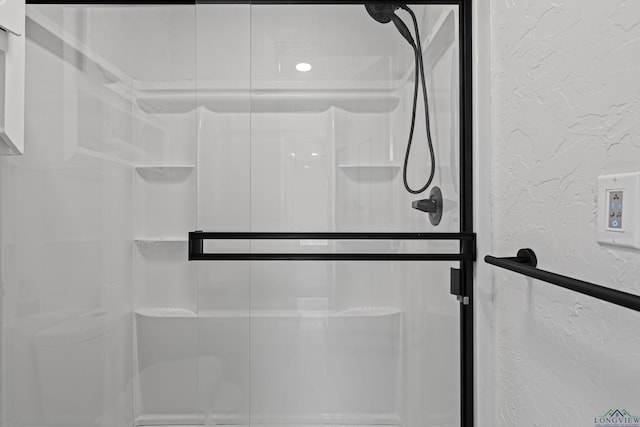 room details featuring a shower with shower door