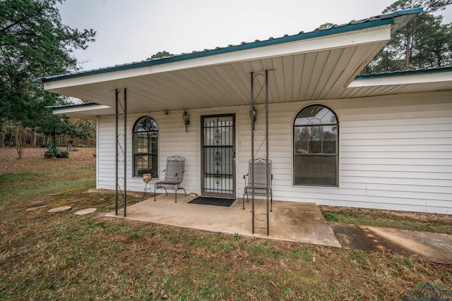 doorway to property with a porch