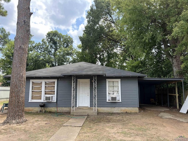 view of front of home featuring an attached carport and cooling unit