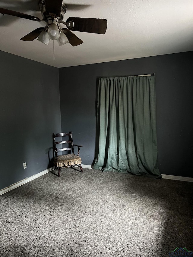 interior space featuring a ceiling fan and baseboards