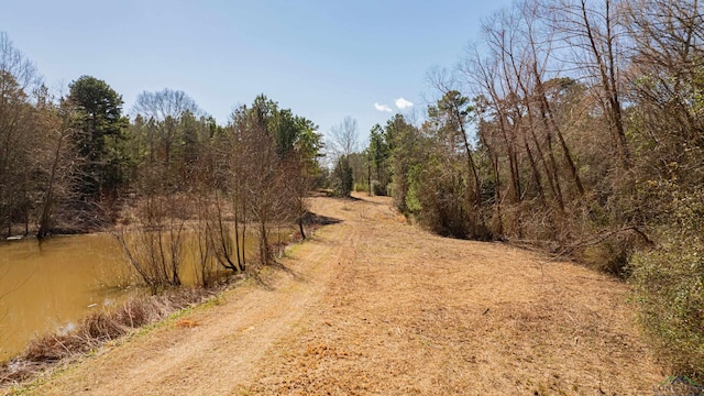 view of street featuring a forest view