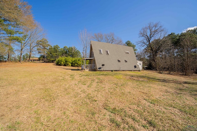 view of home's exterior with a lawn