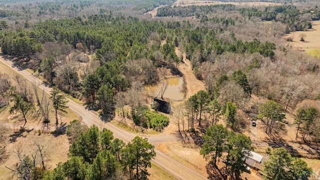 birds eye view of property with a forest view