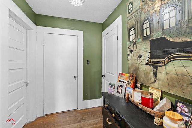 entryway with dark hardwood / wood-style flooring