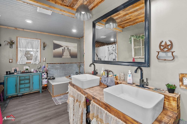 bathroom with hardwood / wood-style flooring, vanity, crown molding, and wooden ceiling