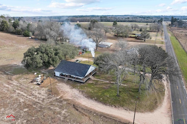 birds eye view of property with a rural view