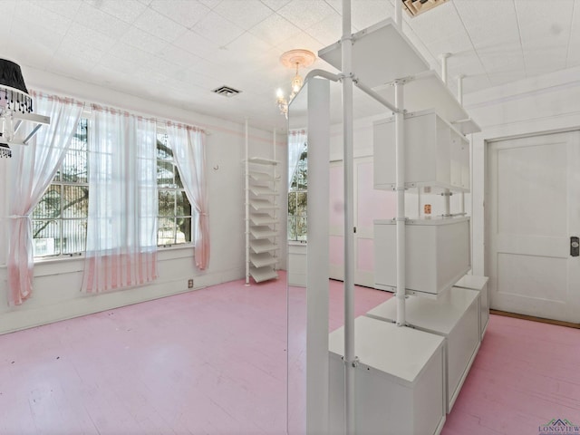 bathroom with plenty of natural light and visible vents