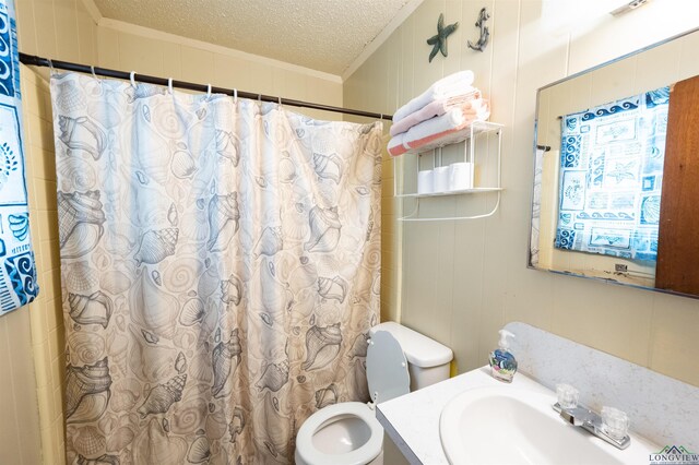 8880 Fm 729, Avinger, TX 75630 - bathroom featuring crown molding, toilet, vanity, a shower with curtain, and a textured ceiling