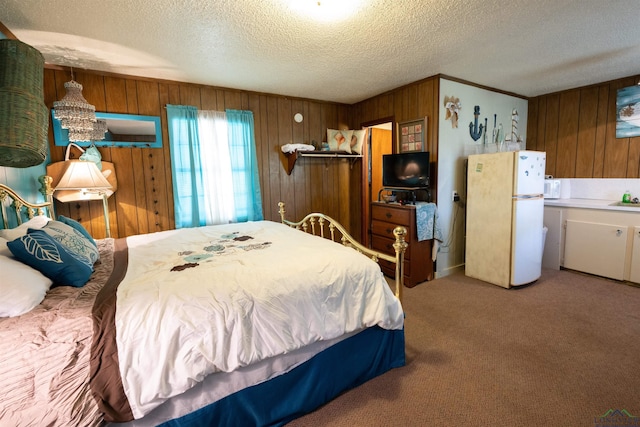 8880 Fm 729, Avinger, TX 75630 - carpeted bedroom with a textured ceiling, wooden walls, and freestanding refrigerator