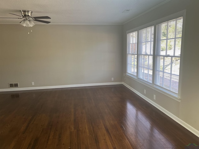 spare room with crown molding, ceiling fan, dark hardwood / wood-style flooring, and a textured ceiling