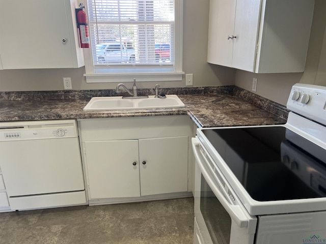 kitchen with white cabinetry, white appliances, and sink