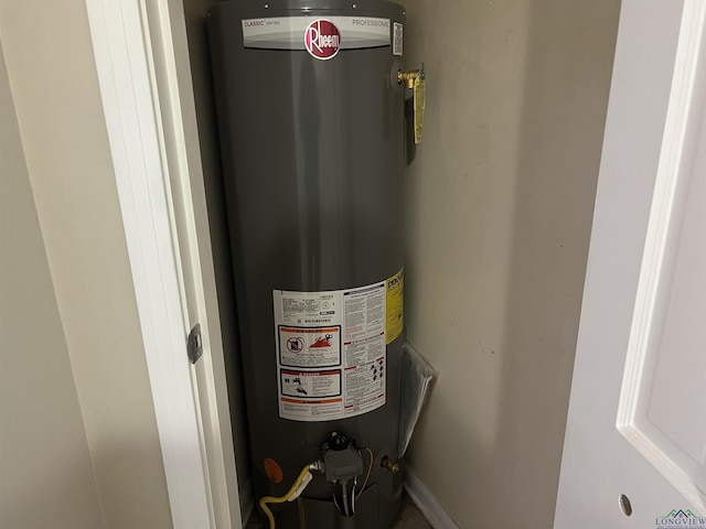 utility room featuring gas water heater