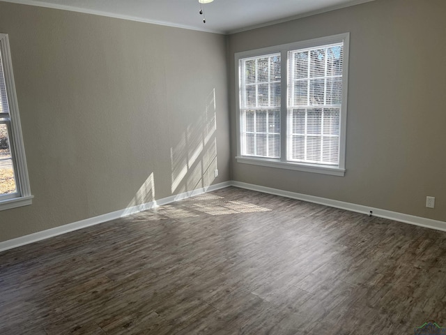 spare room featuring ornamental molding, dark hardwood / wood-style floors, and ceiling fan