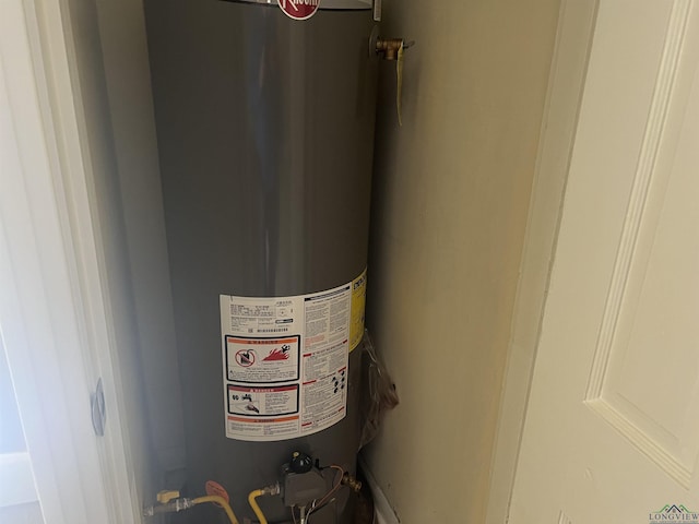 utility room with water heater