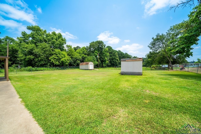 view of yard with a storage unit