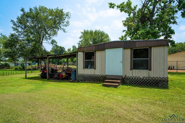 view of outbuilding with a yard