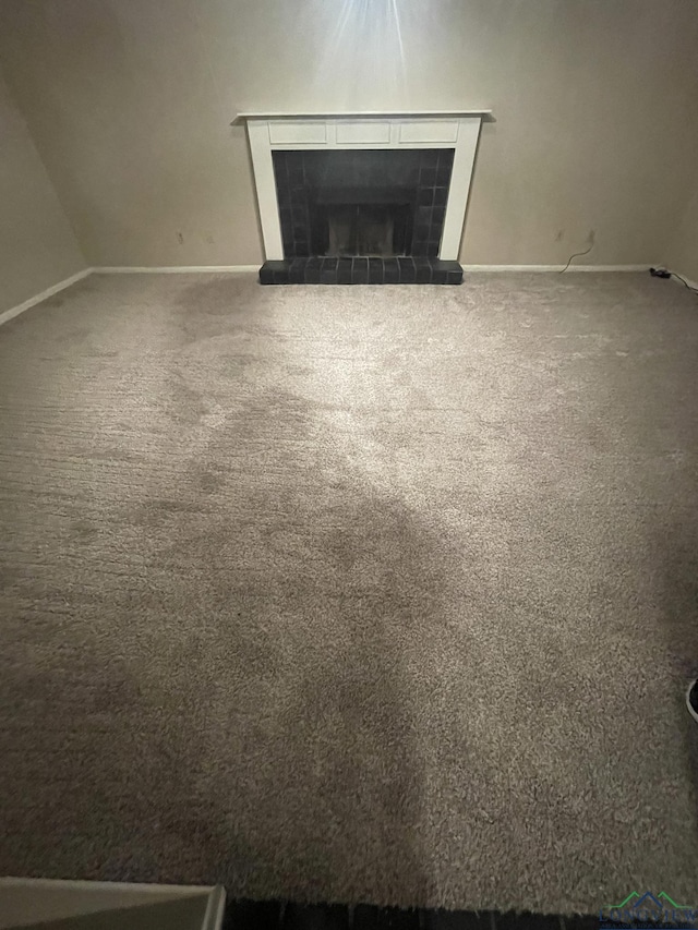 629 Baylor Dr, Longview, TX 75601 - detailed view of baseboards, carpet flooring, and a fireplace