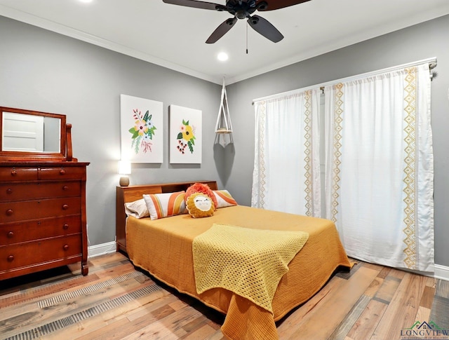 bedroom with recessed lighting, a ceiling fan, hardwood / wood-style flooring, and baseboards