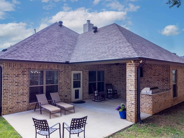 rear view of house featuring a patio